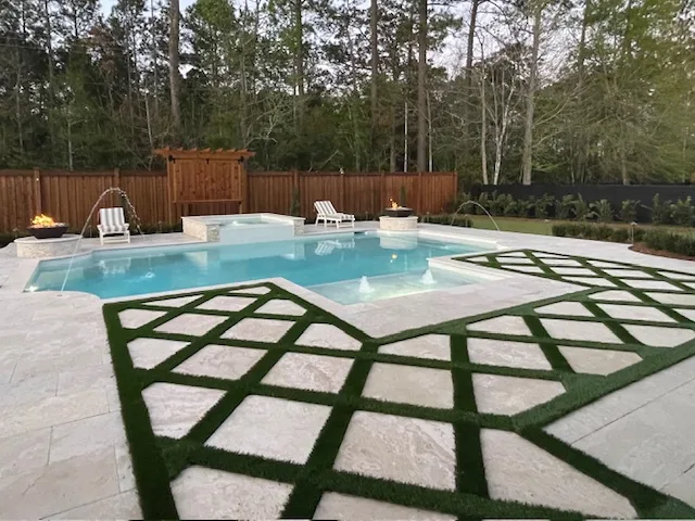 Rectangular pool with deck jets, spa and fire features